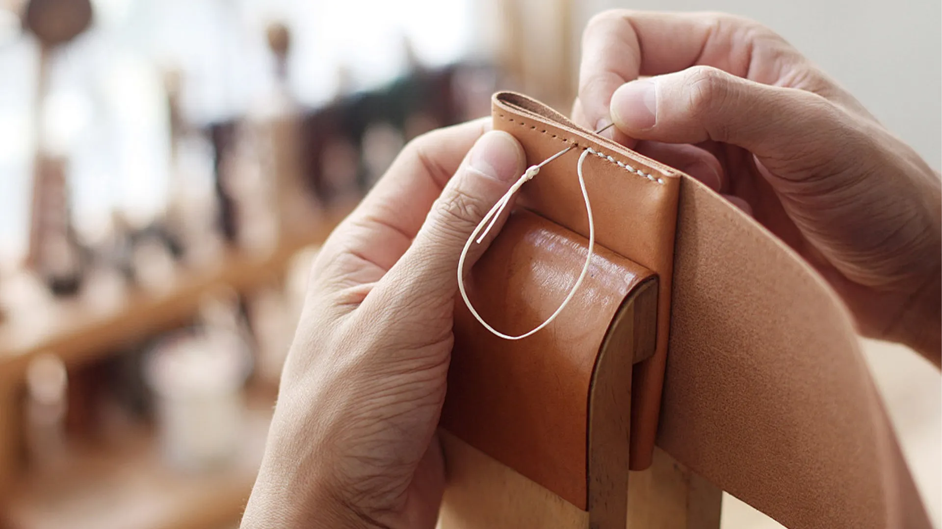 Hand stitching details on leather